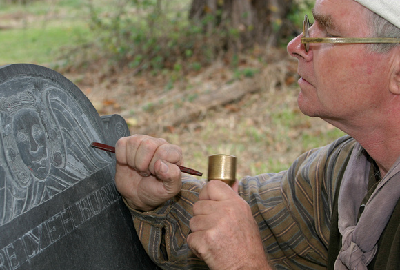 Carving a tomb stone